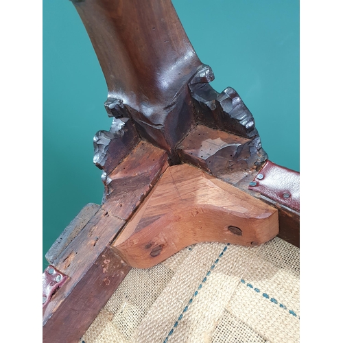 571 - A Georgian style mahogany Elbow Chair on carved cabriole supports and claw and ball feet, with exten... 