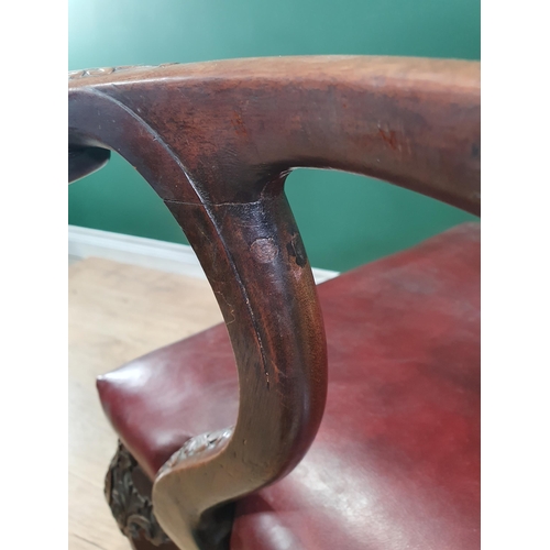 571 - A Georgian style mahogany Elbow Chair on carved cabriole supports and claw and ball feet, with exten... 