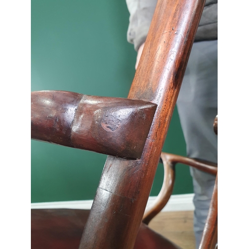 571 - A Georgian style mahogany Elbow Chair on carved cabriole supports and claw and ball feet, with exten... 