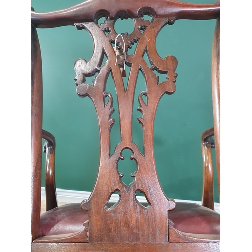 571 - A Georgian style mahogany Elbow Chair on carved cabriole supports and claw and ball feet, with exten... 