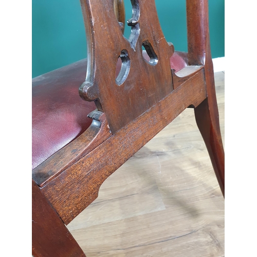 571 - A Georgian style mahogany Elbow Chair on carved cabriole supports and claw and ball feet, with exten... 