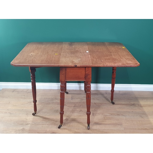 573 - A 19th Century mahogany drop leaf Dining Table on ring turned supports and casters 3ft W x 2ft 6in H