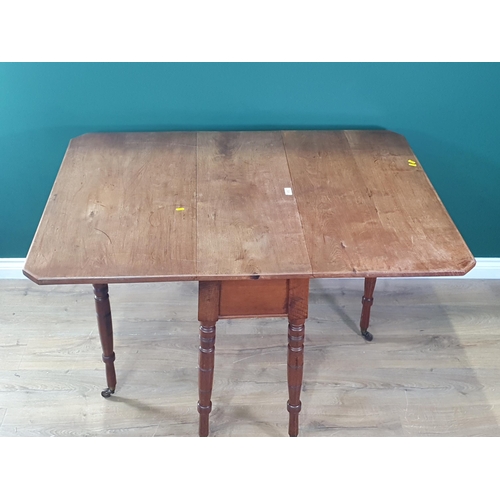 573 - A 19th Century mahogany drop leaf Dining Table on ring turned supports and casters 3ft W x 2ft 6in H