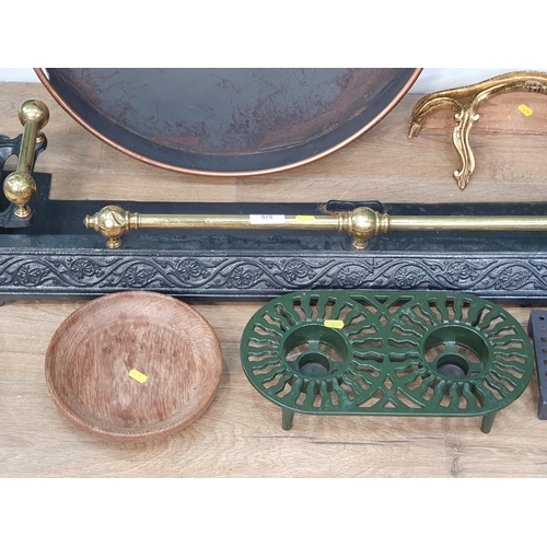 575 - A Victorian cast iron and brass Fender, a circular metal Tray, brass Lantern, ceramic Charger, two T... 