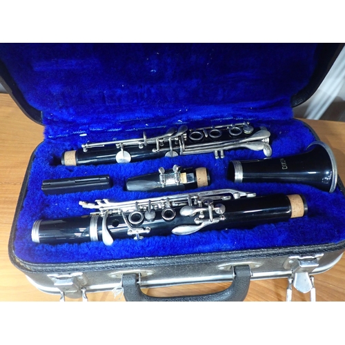 595 - A Dixon Clarinet with plated mounts, in case