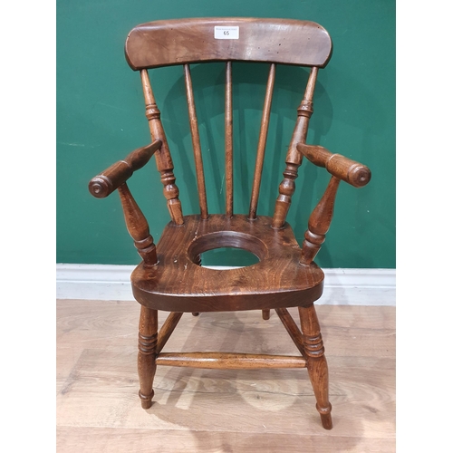 65 - A 19th Century Childs Potty Chair, on turned legs.