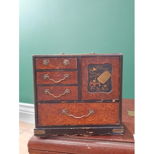 702 - Three Canteen Boxes, a parquetry Tea Caddy, a rosewood inlaid Box and a miniature lacquered Cabinet