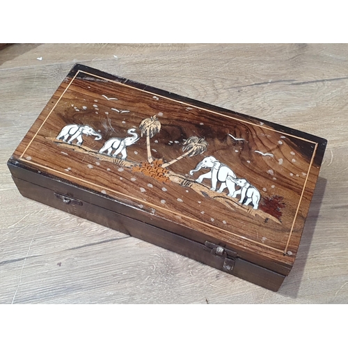 702 - Three Canteen Boxes, a parquetry Tea Caddy, a rosewood inlaid Box and a miniature lacquered Cabinet