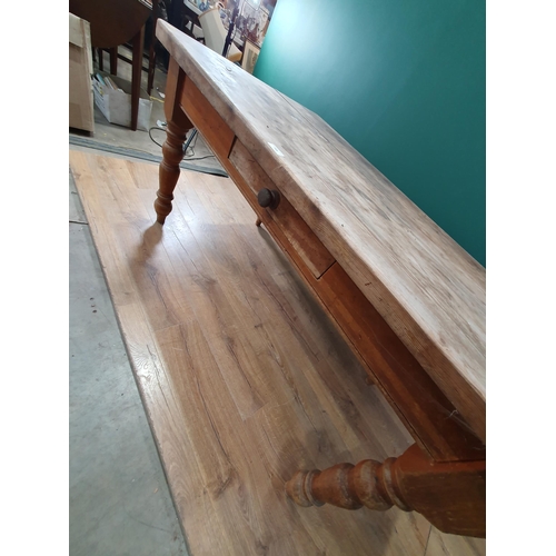 711 - A Victorian pine Kitchen Table on turned supports 4ft 10in W x 2ft 6in H