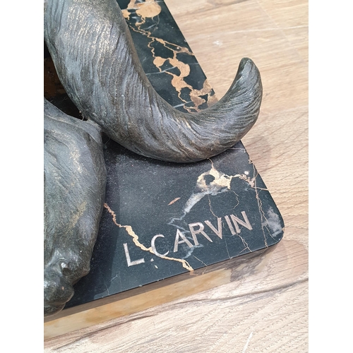 717 - A bronze effect Sculpture of two Alsatians on marble effect base signed L. Carvin 2ft 2in L x 1ft 4i... 