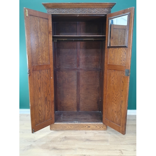 720 - An oak Wardrobe fitted pair of linenfold panel doors