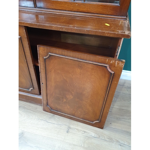 723 - A reproduction mahogany glazed Bookcase with a pair of astragal glazed doors above a pair of cupboar... 