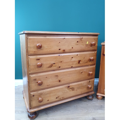 724 - A modern pine two door Cupboard, a pine Chest of four drawers and a Robing Mirror