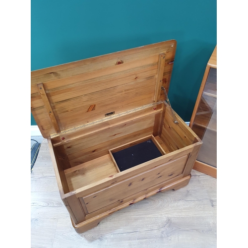 727 - A modern pine Blanket Chest and a Bookcase with sliding doors