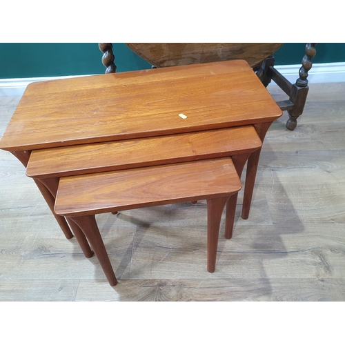 739 - An oak Gateleg Table, a Nest of three Tables and a two tier side Table with fitted drawer.