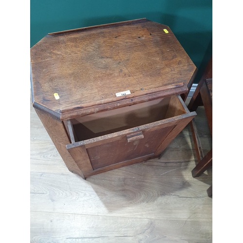 742 - An oak two tier Coffee Table with fold out magazine rack and a set of three oak bar back Chairs.