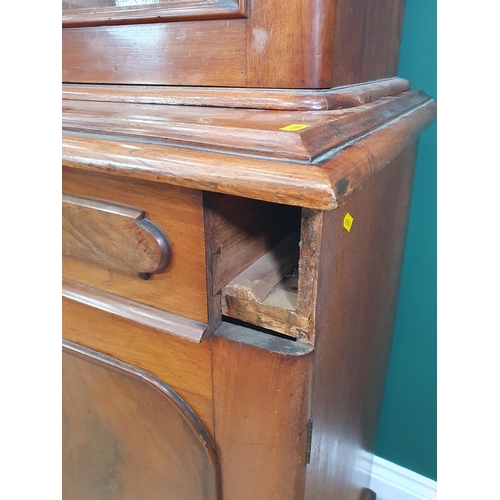 747 - A Victorian walnut glazed Bookcase, the base fitted drawers and cupboard doors on plinth base, 6ft 1... 