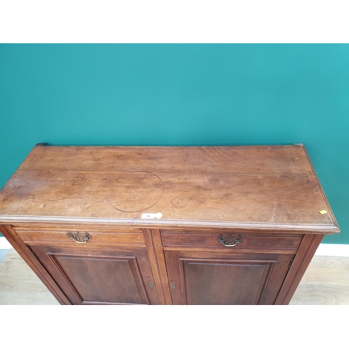 796 - A Victorian walnut Cupboard fitted two frieze drawers above two doors 4ft W x 2ft 11in H