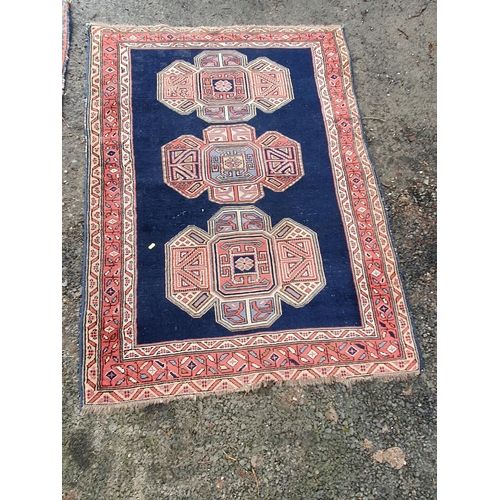 853 - A blue ground multi-border Persian Rug with three central motifs, 5ft 7in x 4ft 1in and another red ... 