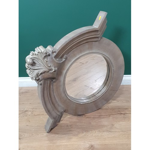 498 - An elaborate circular Wall Mirror with scrolled and leafage surmount, 2ft 9in H x 3ft W