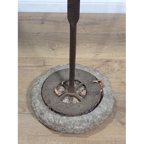 49 - An early iron Spit with adjustable two prong fork on tapering shaft, circular base, mounted on an as... 