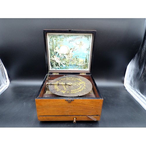 50 - A late Victorian walnut cased Polyphon playing eight inch discs, 10in wide, plus eight discs, made i... 