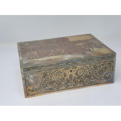 821 - A silver plated Sewing or Jewellery Box with engraved Parisian Scene to lid titled 'Le Tour est Joue... 