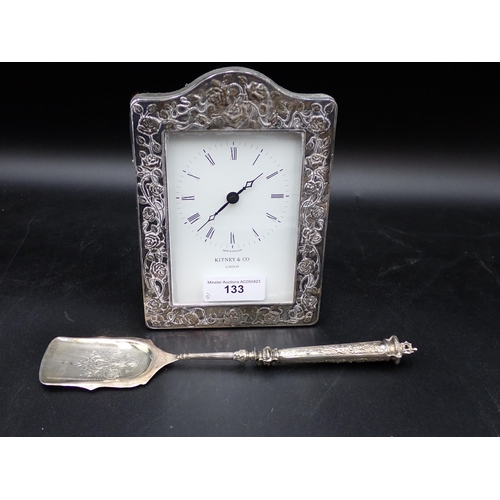 823 - A Continental silver Server with floral engraving, marked 800, in case, and a floral decorated Clock... 