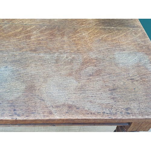 489 - A 19th Century oak Kitchen Table with plank top fitted frieze drawer (one frieze drawer missing) and... 