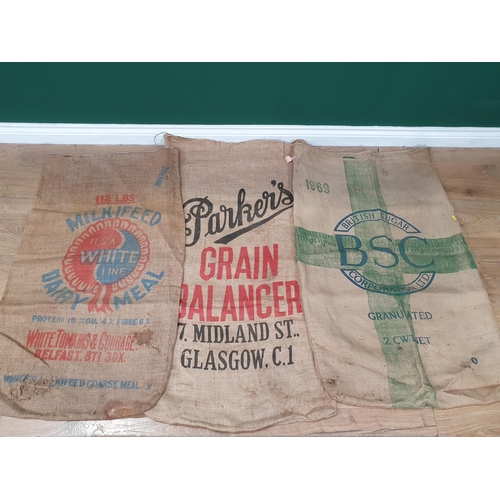 10 - Five hessian Sacks with various advertising logos (some repairs).