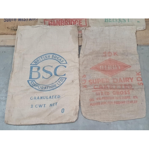 11 - Five hessian Sacks with various advertising logos (some repairs).