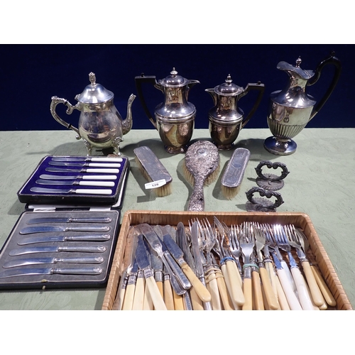 128 - Three silver mounted Brushes, A/F, three Hot Water Jugs, a Coffee Pot, two sets of six Tea Knives, t... 