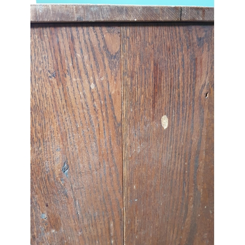 13 - An oak Cupboard fitted single long drawer over two short drawers, above pair of panelled doors, 3ft ... 