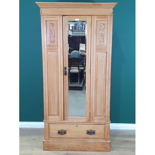 14 - A satinwood Single mirror door Wardrobe with carved leafage panels and single fitted drawer to base,... 