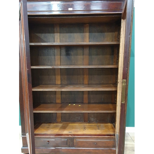 17 - A mahogany Bookcase the moulded cornice above pair of glazed doors with four adjustable shelves, abo... 