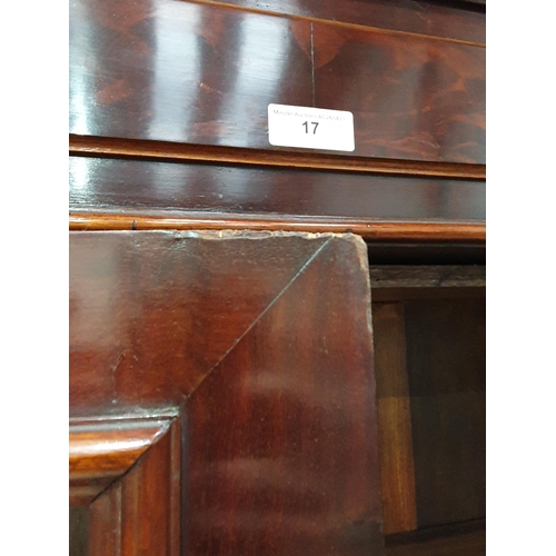 17 - A mahogany Bookcase the moulded cornice above pair of glazed doors with four adjustable shelves, abo... 