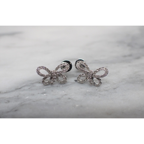 170 - A pair of Diamond Bow Earrings each set eight-cut stones throughout in white gold stamped 585