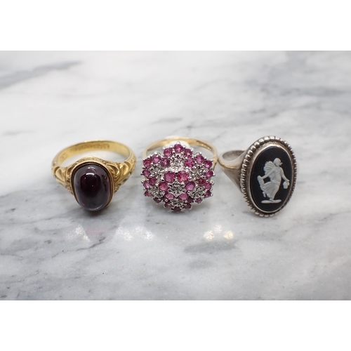 190 - A Victorian Garnet cabochon Ring set oval stone to scroll carved mount in 15ct gold, approx 3.20gms,... 