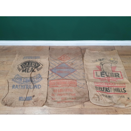 20 - Five hessian Sacks with various advertising logos (some repairs).