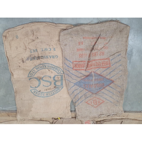 21 - Five hessian Sacks with various advertising logos (some repairs).