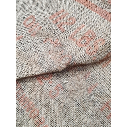 21 - Five hessian Sacks with various advertising logos (some repairs).