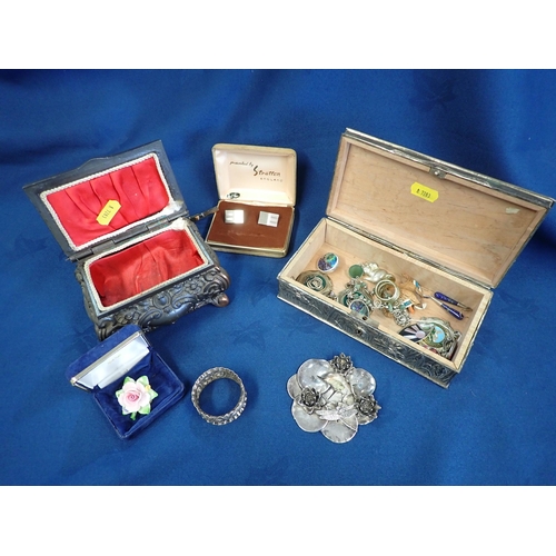 219 - Two embossed metal Jewel Boxes containing costume jewellery, silver Napkin Ring etc