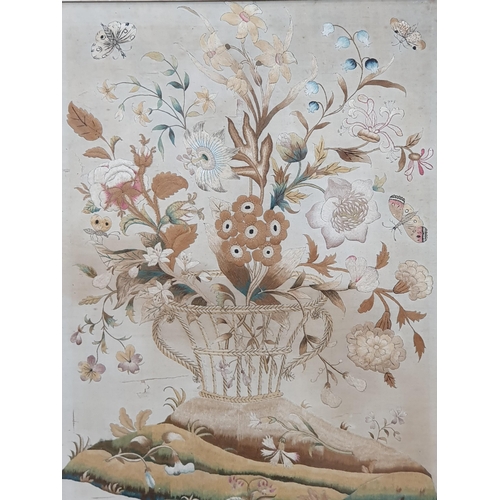 23 - An antique Silk and Needlework Panel of basket of Flowers and Insects in maple frame A/F.