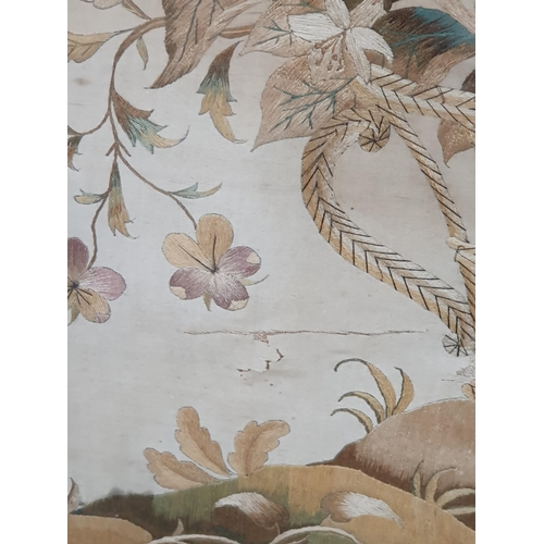 23 - An antique Silk and Needlework Panel of basket of Flowers and Insects in maple frame A/F.