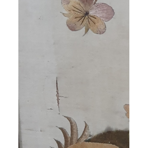 23 - An antique Silk and Needlework Panel of basket of Flowers and Insects in maple frame A/F.