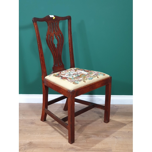 25 - An Oak 18th century style splat back chair with upholstered seat.