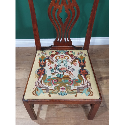 25 - An Oak 18th century style splat back chair with upholstered seat.