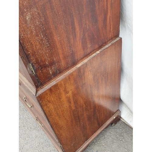 298 - A 19th Century mahogany Linen Press with dentil cornice above a pair of  panelled doors enclosing sl... 