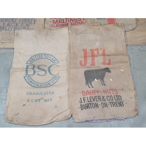 30 - Five hessian Sacks with various advertising logos (some repairs).