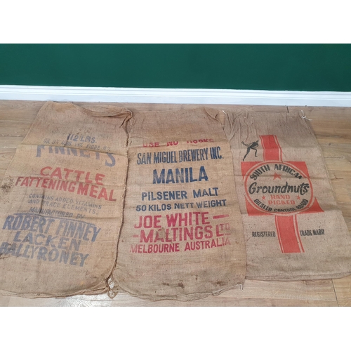 30 - Five hessian Sacks with various advertising logos (some repairs).